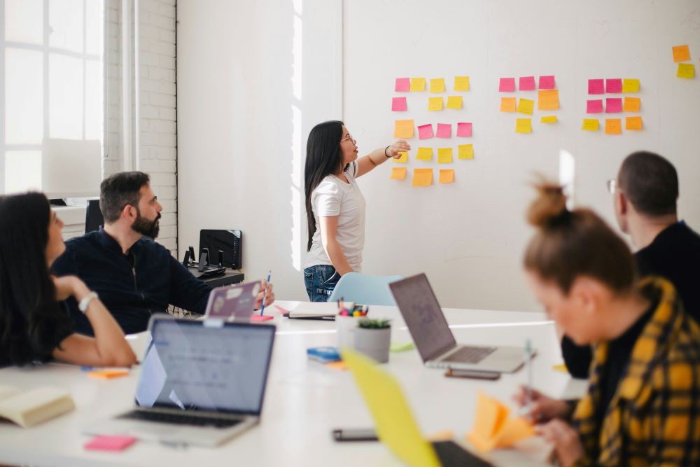 coworkers brainstorming in meeting room