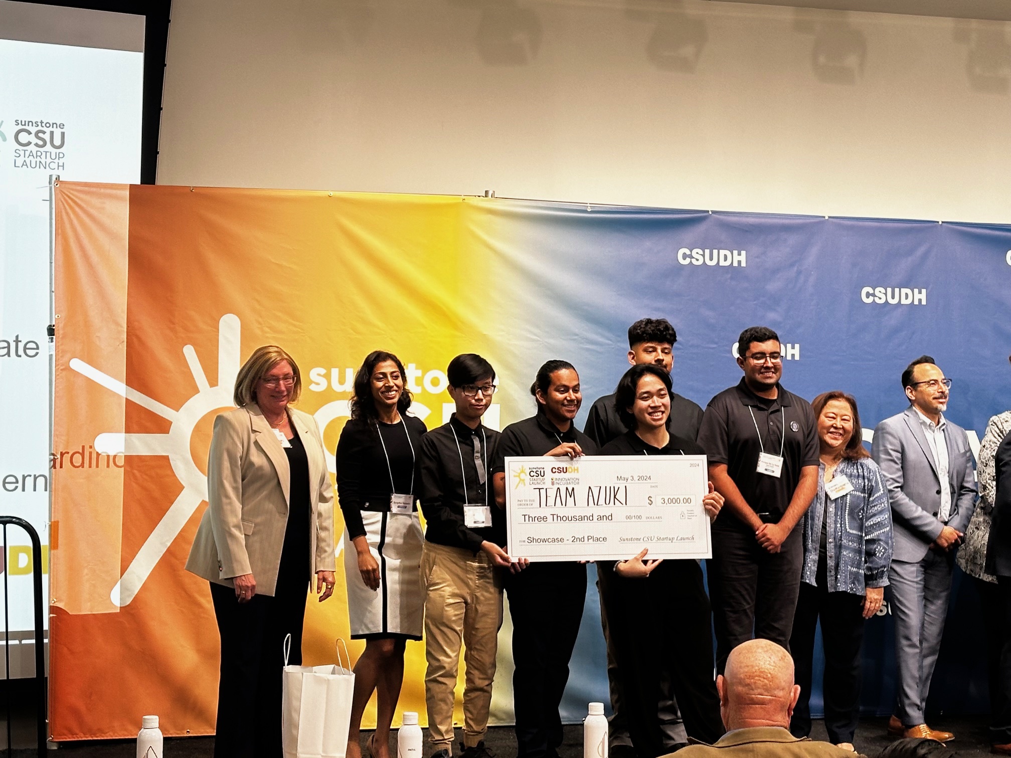 Student team holding their winning check