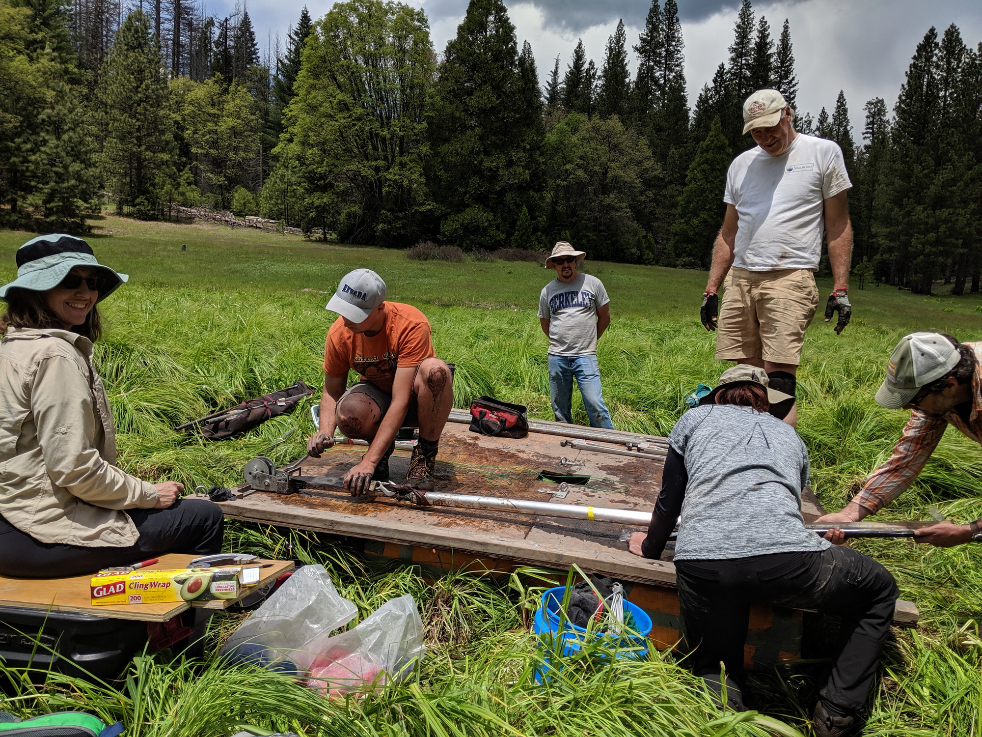 Paleoecology fieldwork. Image shows extraction of meadow sediment core