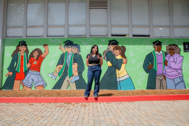 Giselle Lacap in front of Becoming Mural