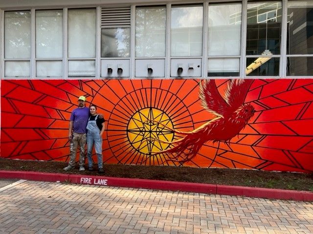 Nicole Sena in front of Becoming Mural