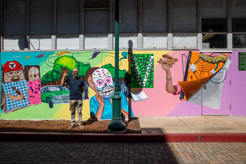 Luis Garcia in front of his mural.