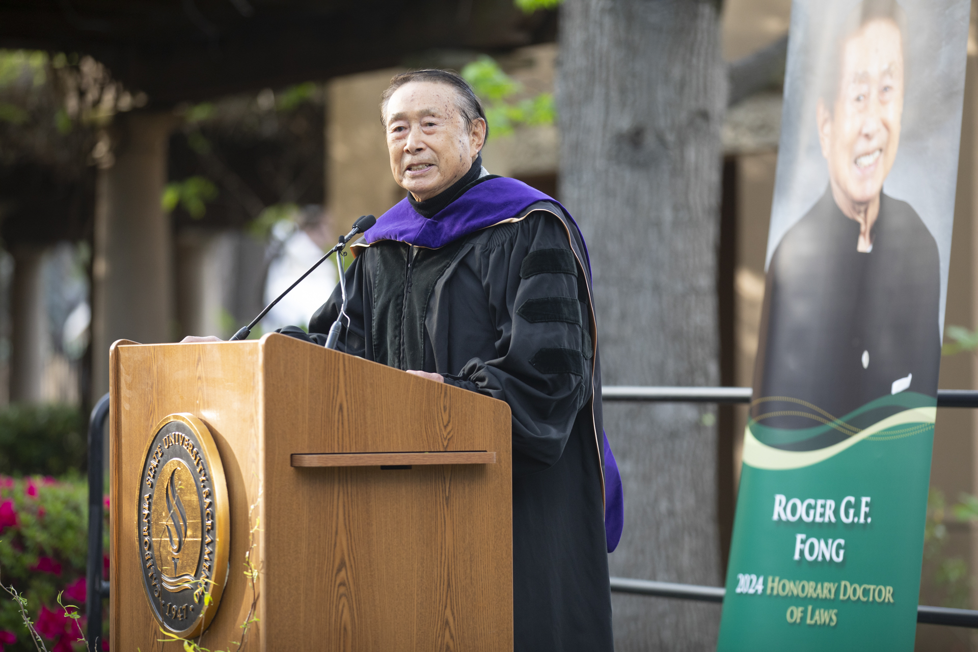 Roger Fong accepts honorary degree.