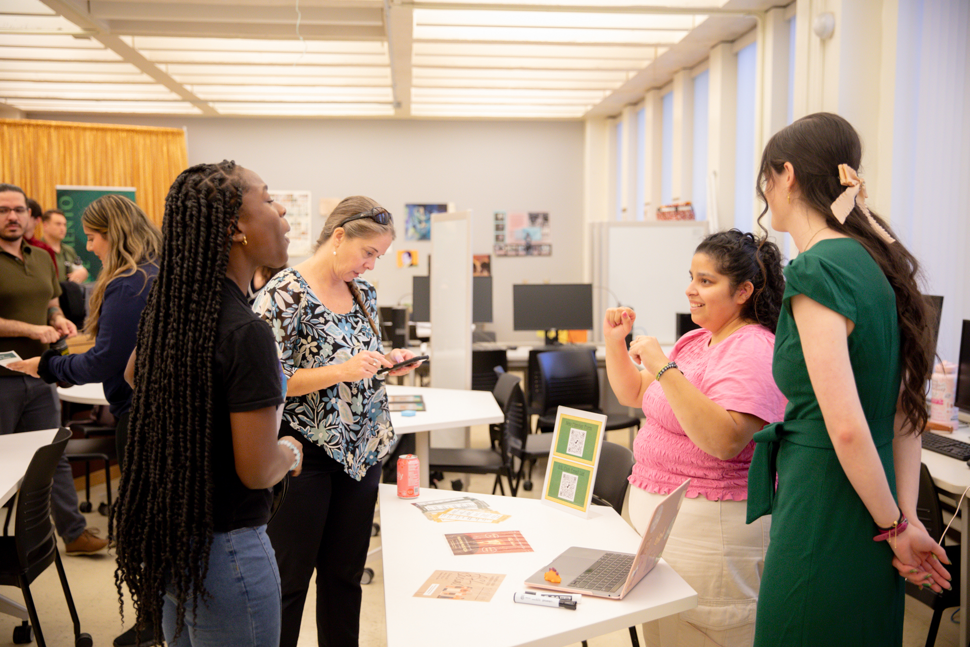 Visitors to the ASL Lab Open House speak with representatives from the ASL Club.