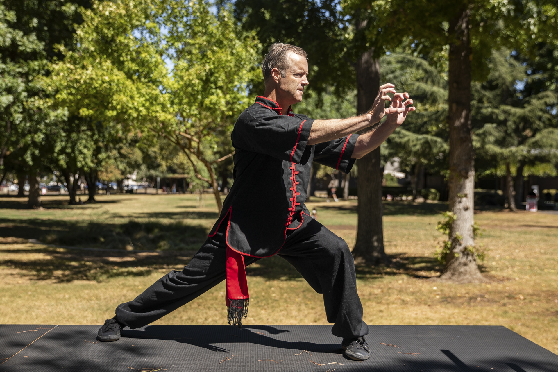 Mark Wheeler performs tai chi moves. 