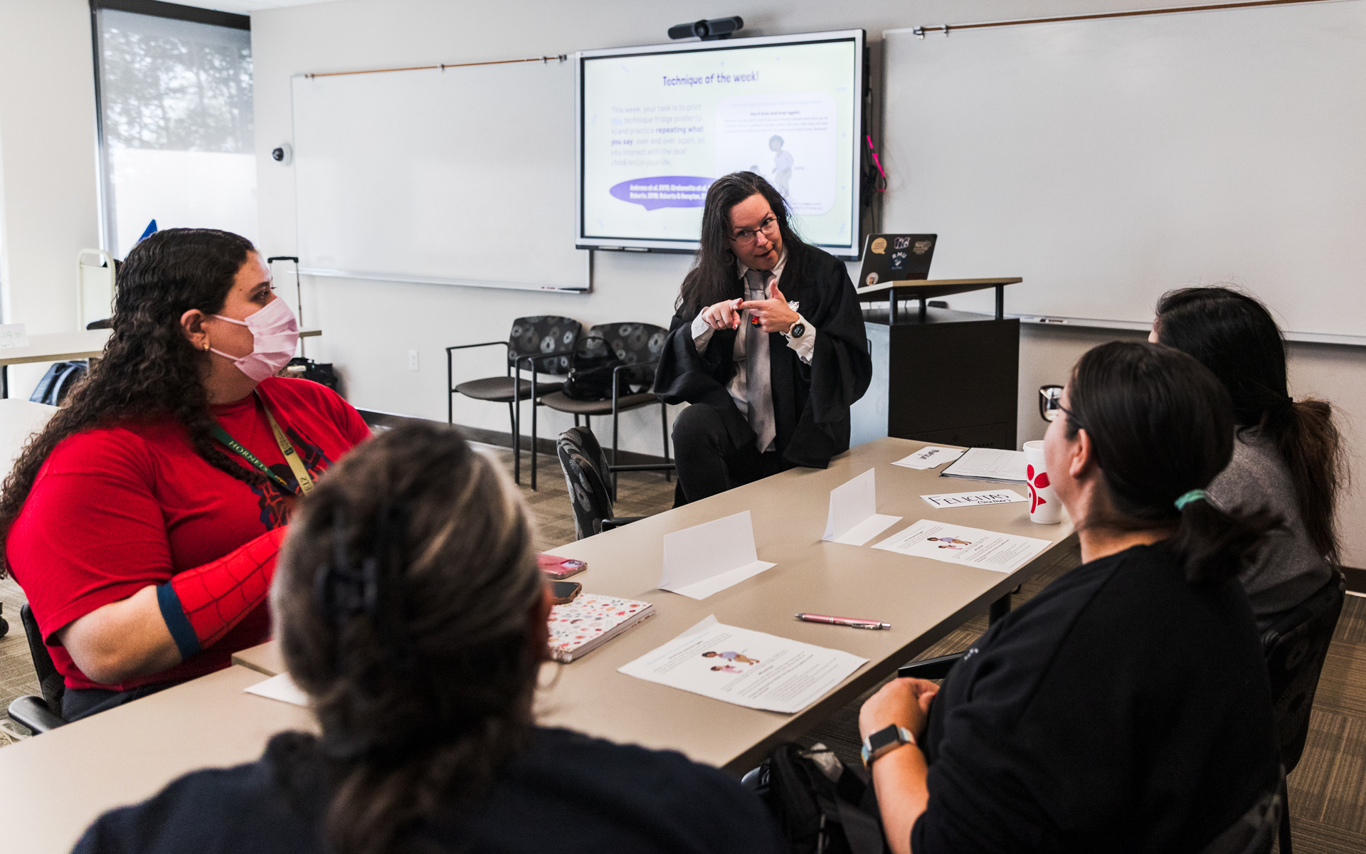 Leah Geer teaches ASL for families of Deaf children course. 