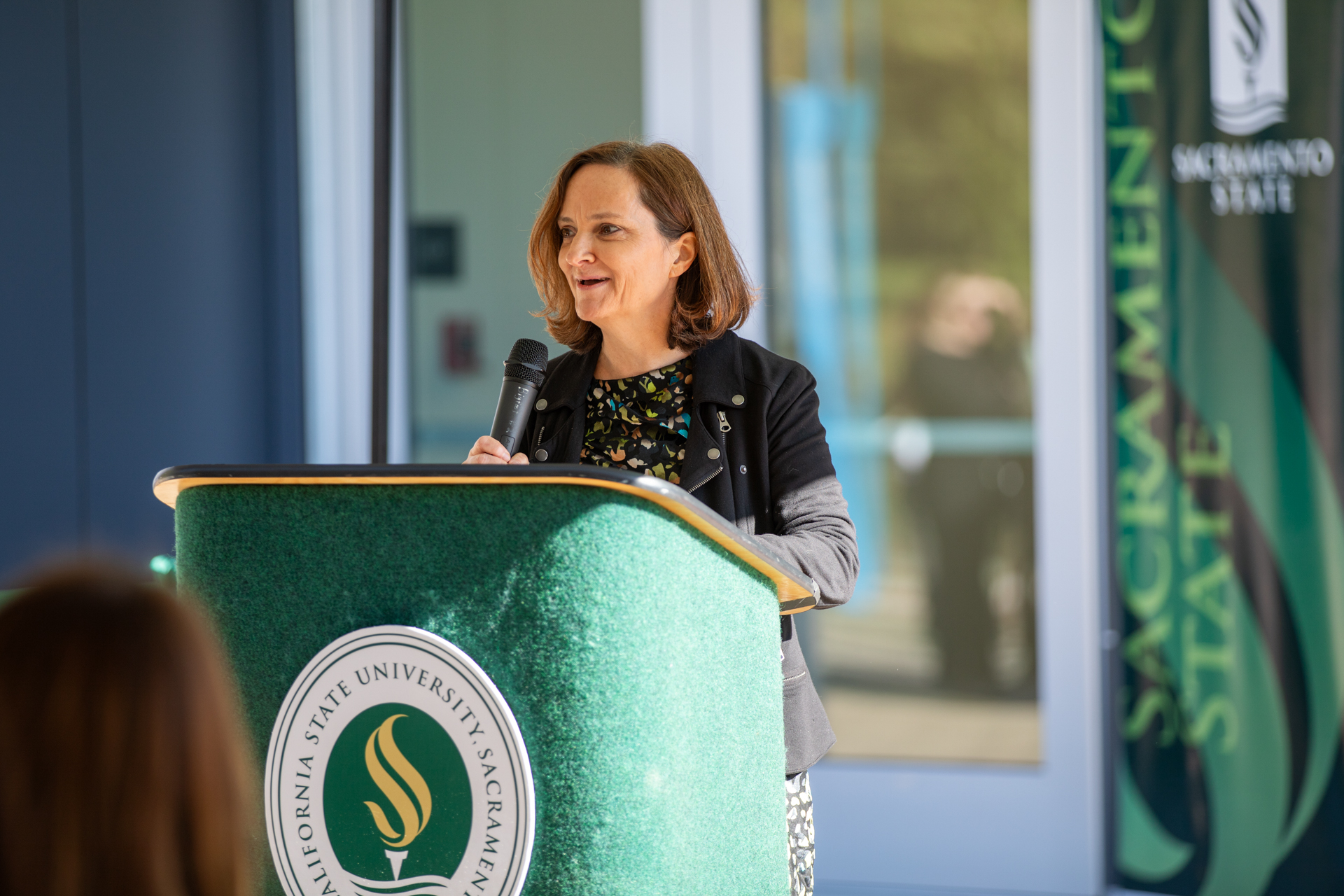 Rachel Clarke speaking during new art building ribbon cutting ceremony.