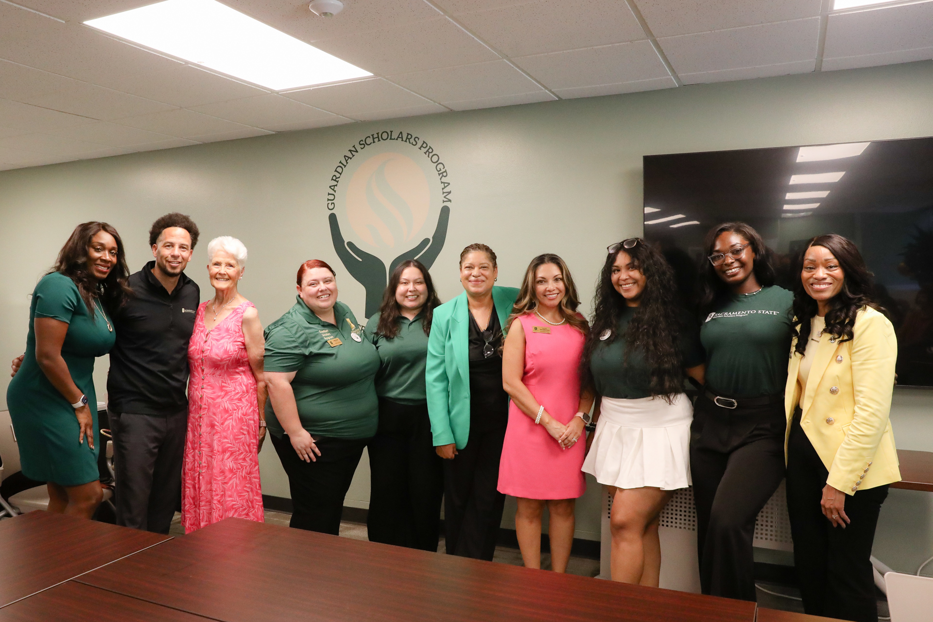 Members of the Guardian Scholars Program and campus administration pose during the GSP opening.