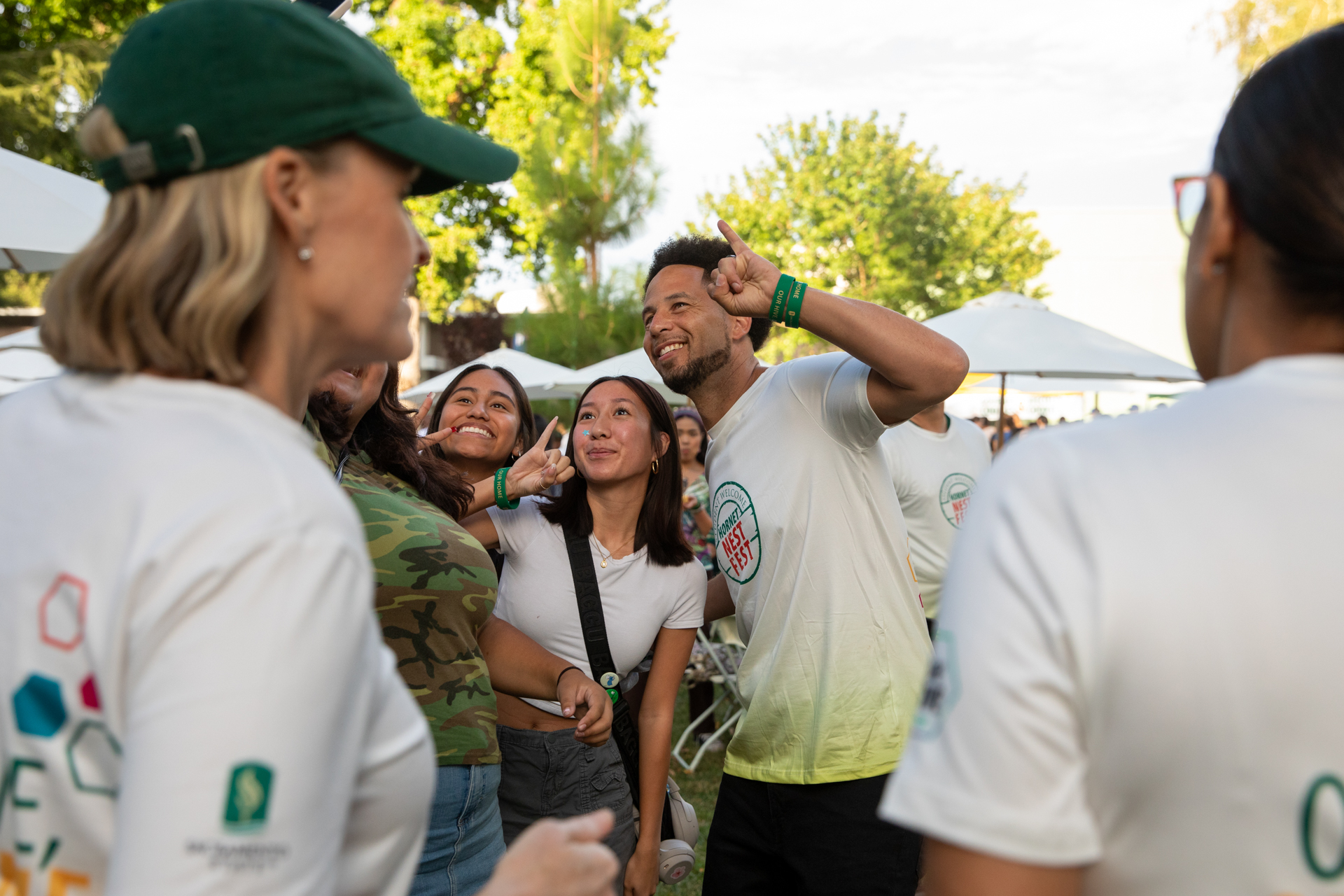 President Luke Wood poses for a selfie with students at the Hornet Nest Fest.