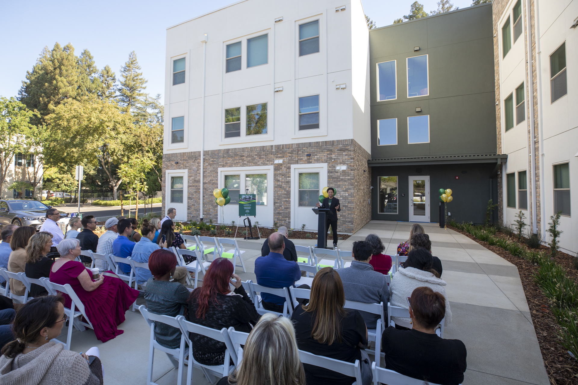 President Luke Wood discusses Nine Ten Place during the grand opening event. 